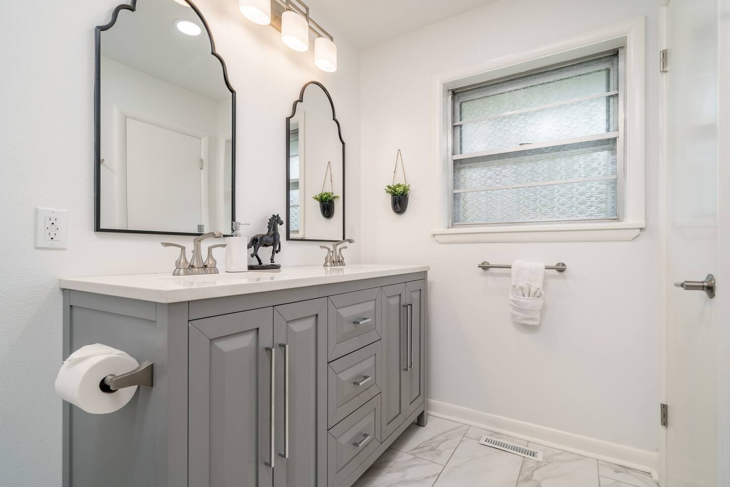 Bathroom with shower and tub with  Luxury towels, body wash and shampoo.