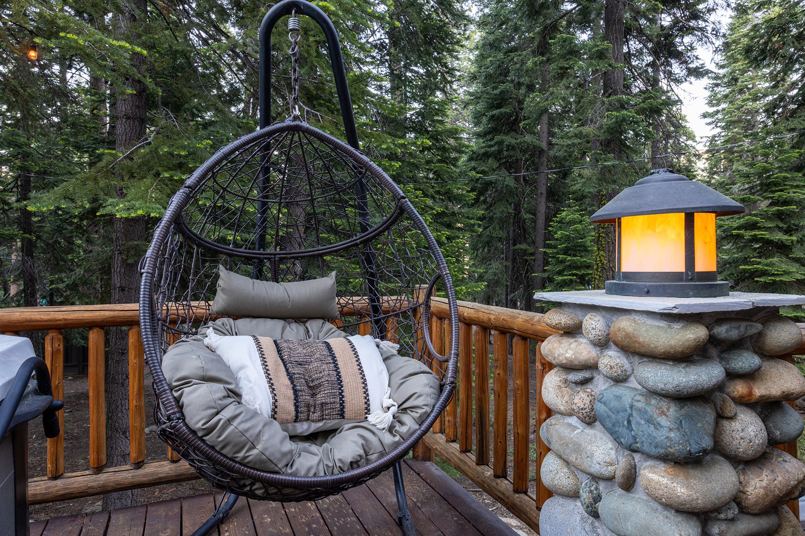Claim the egg swing with your coffee and a book — just you, the pines, and the slow morning you came for.