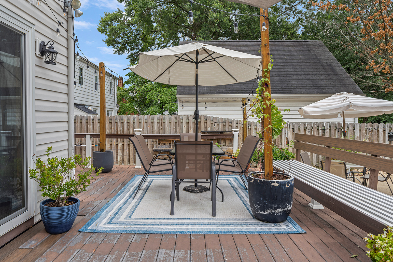 Outdoor Retreat: Gather under the sun with friends on this chic deck, perfect for al fresco dining!