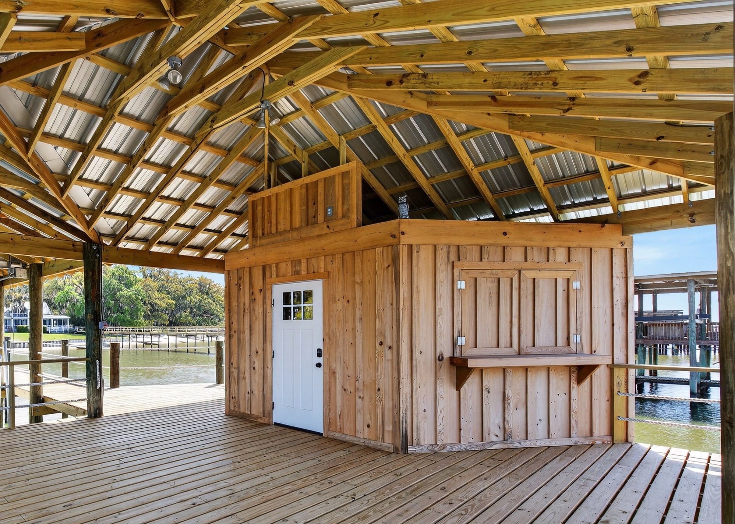 Covered dock area with shaded space to relax above the water