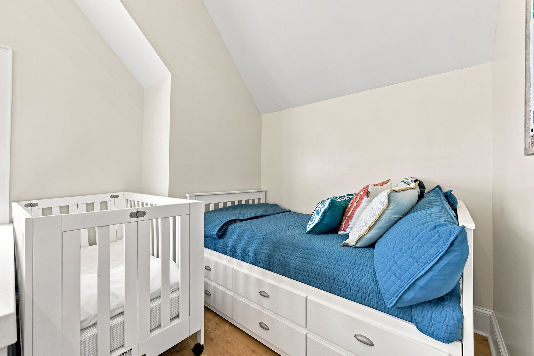 The top floor loft features an additional twin bed, offering flexible sleeping arrangements for families and groups.