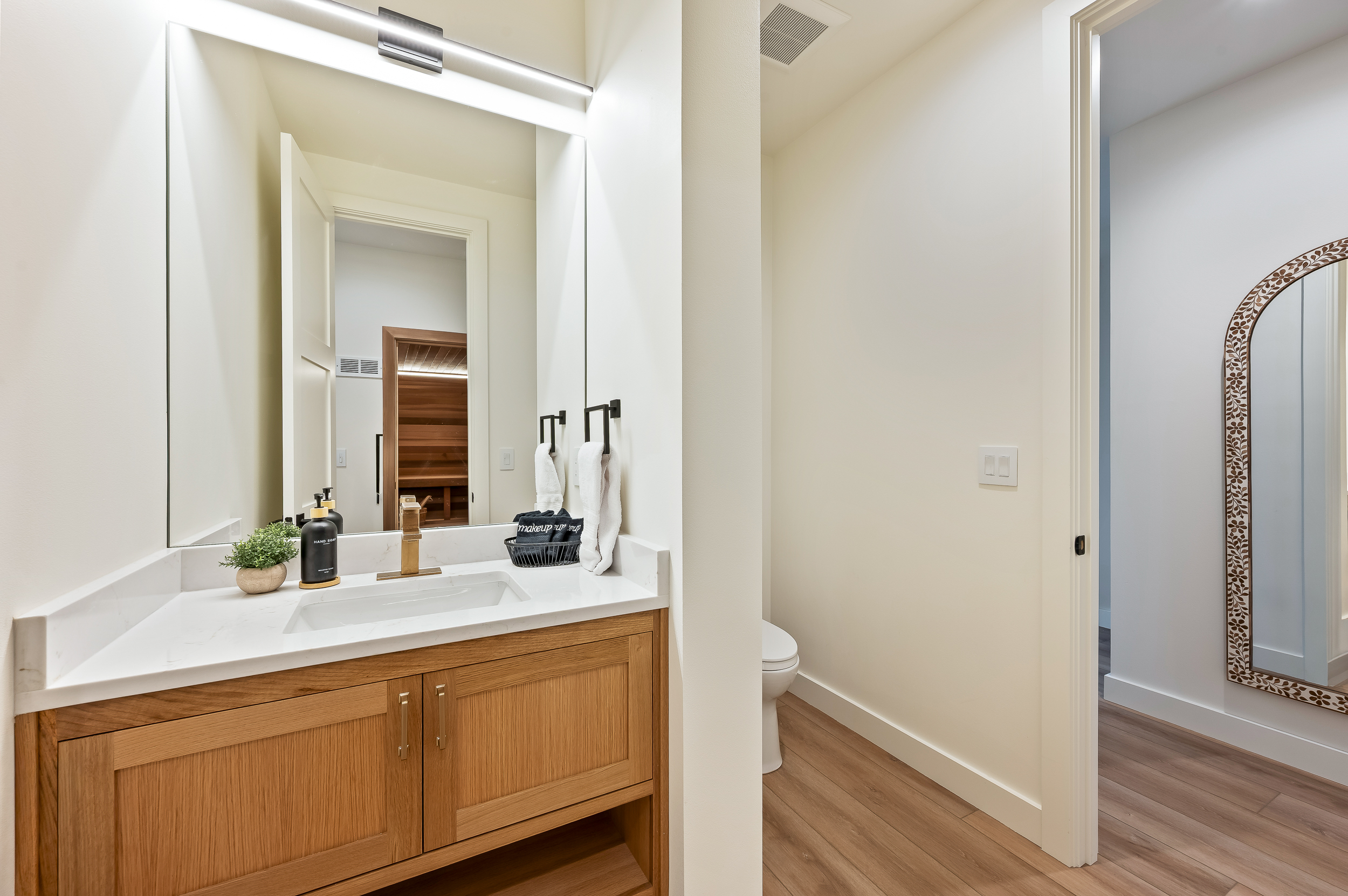 Bathroom #3 of 8 - Main floor powder room, adjacent to indoor sauna and indoor steam room and shower