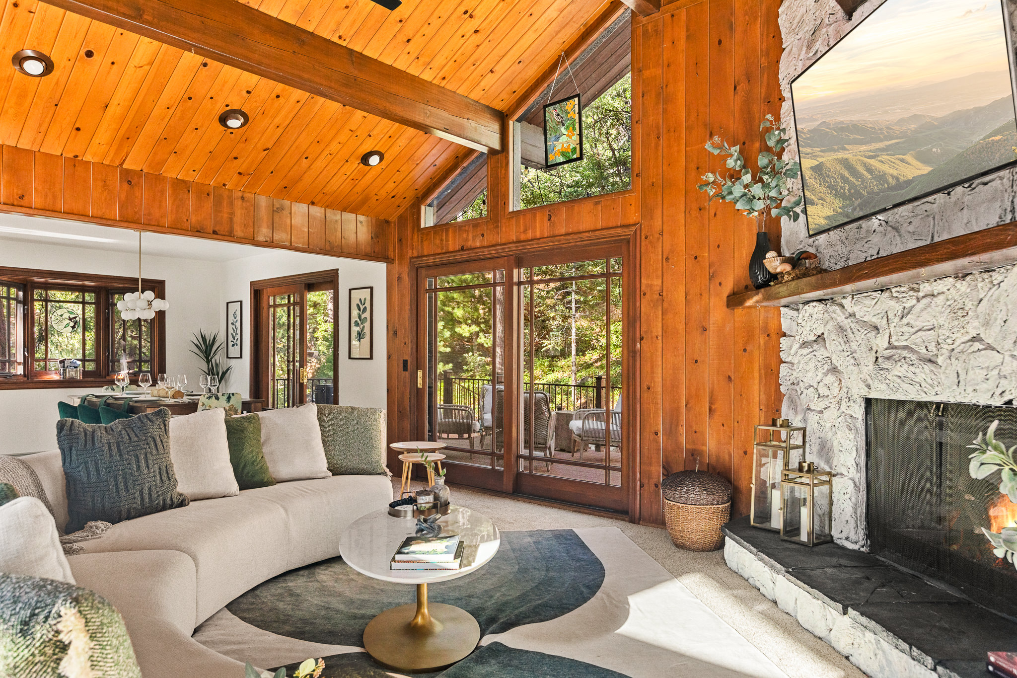 Just off the living room is the dining area and kitchen, and direct access to the spacious upper deck.   Spend time in nature without sacrificing the comforts of a luxury home!