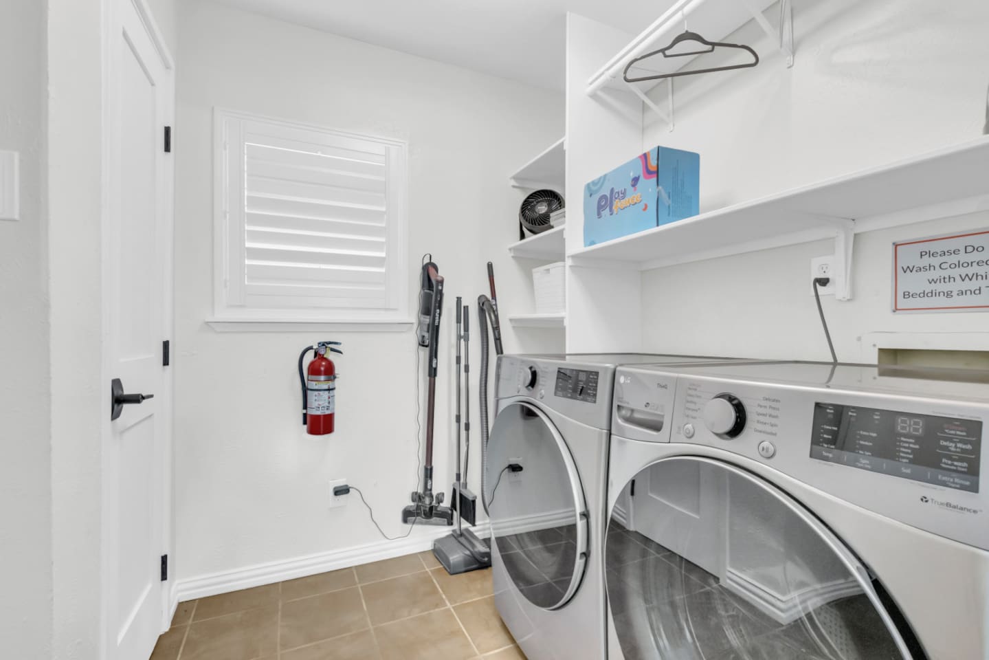 Convenient in-home laundry room with modern washer/dryer and built in storage to keep your stay efficient