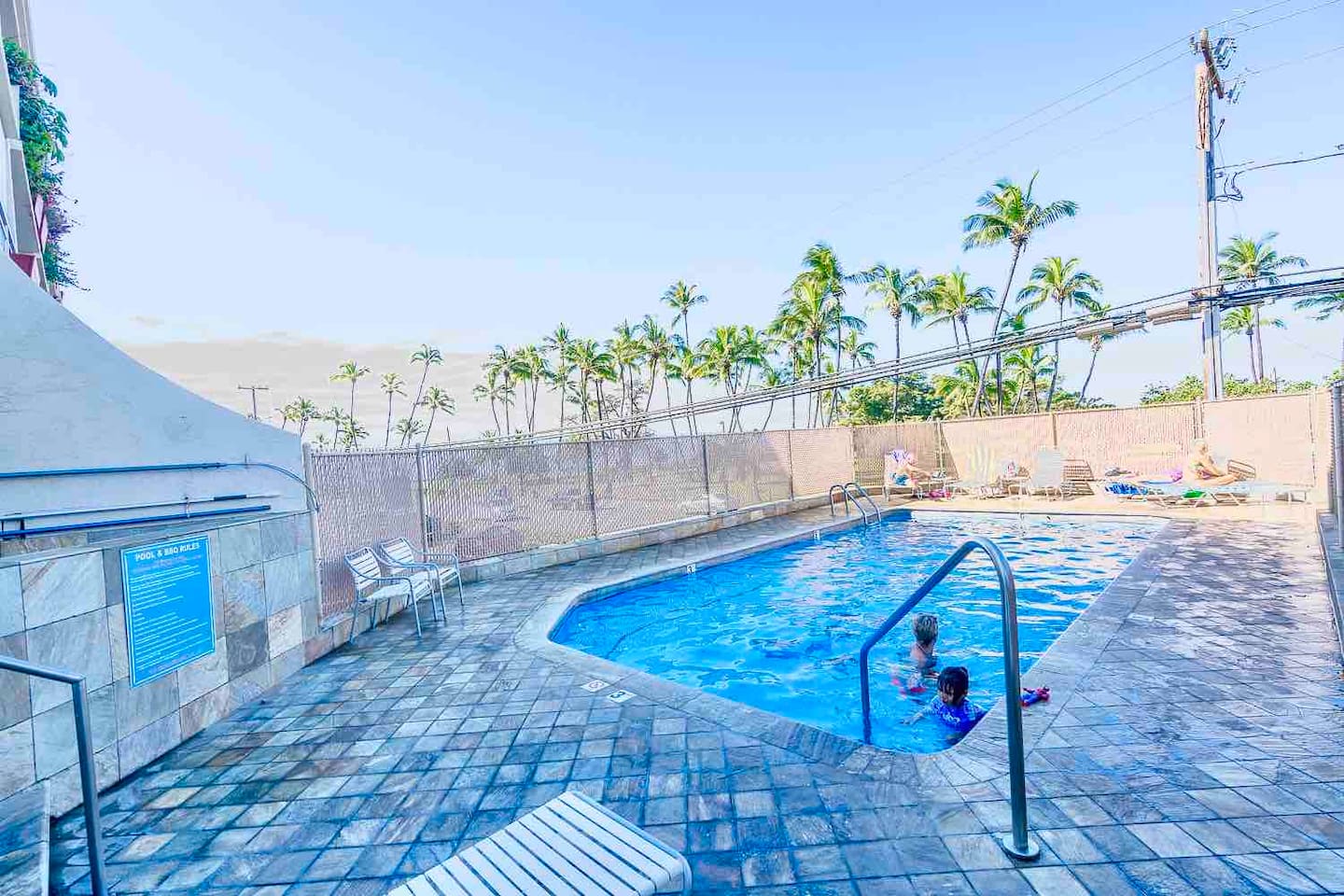 Plenty of lounge chairs to soak up the sun.  There are also bbq grills, an outdoor shower, and table and chair dining areas onsite right at the pool.