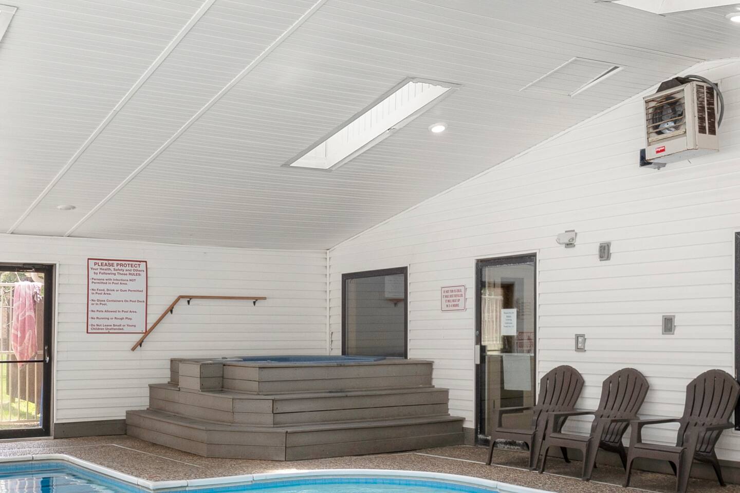 Indoor Pool & Spa Retreat: Dive into relaxation with a bubbly hot tub and inviting lounge chairs!