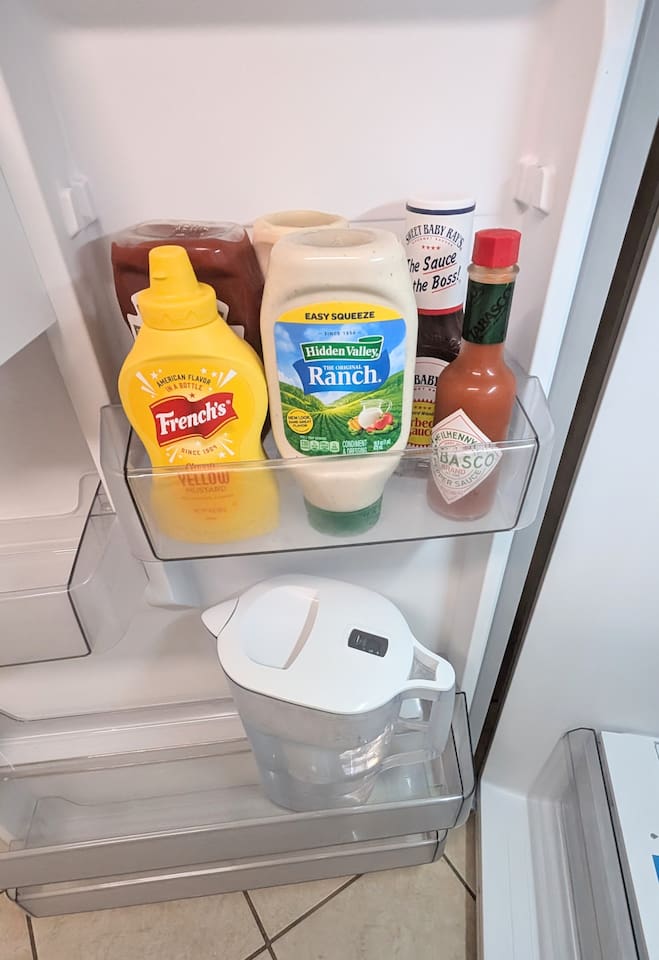 Filtered water pitcher and basic condiments for guest use including: ketchup • mustard • ranch • bbq sauce • mayo • hot sauce