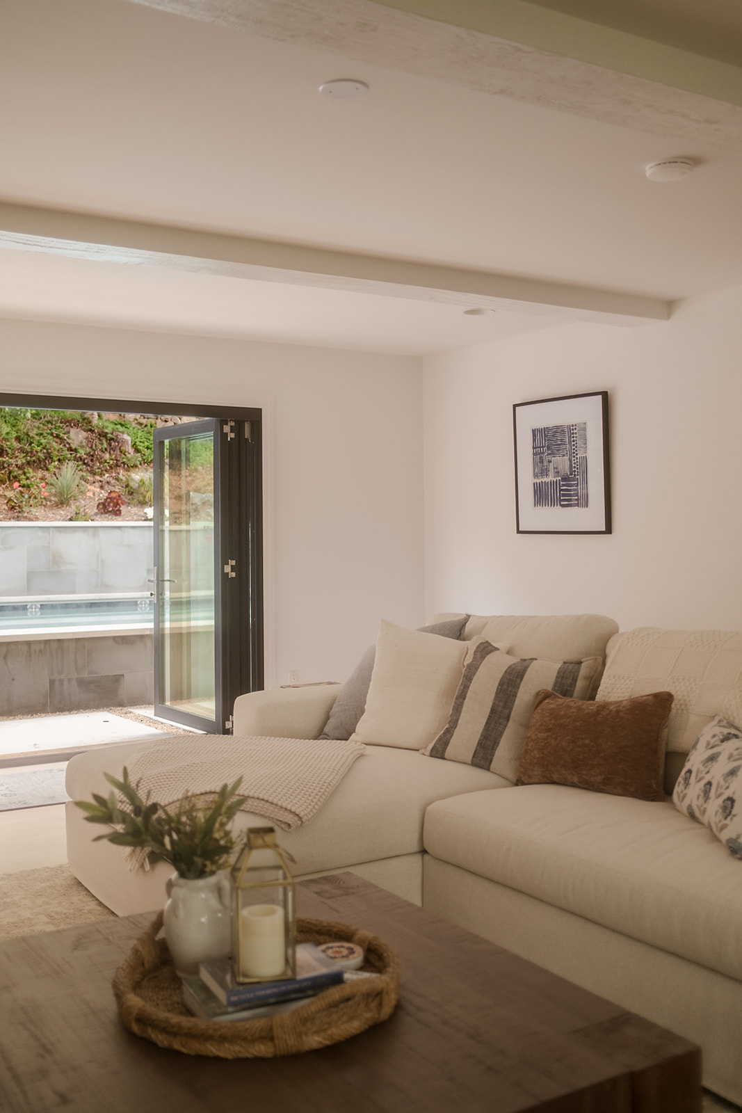Comfortable Family Room Opens to the Pool