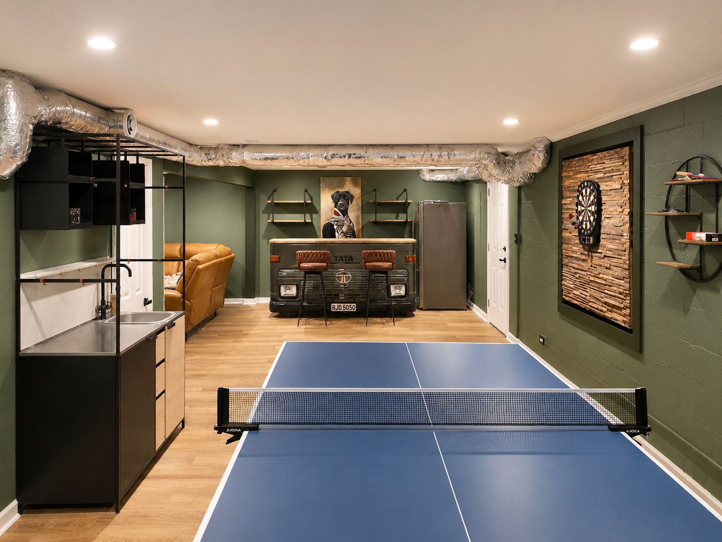 Game room view with ping pong, wet bar, lounge seating and an easy setup for family game nights.
