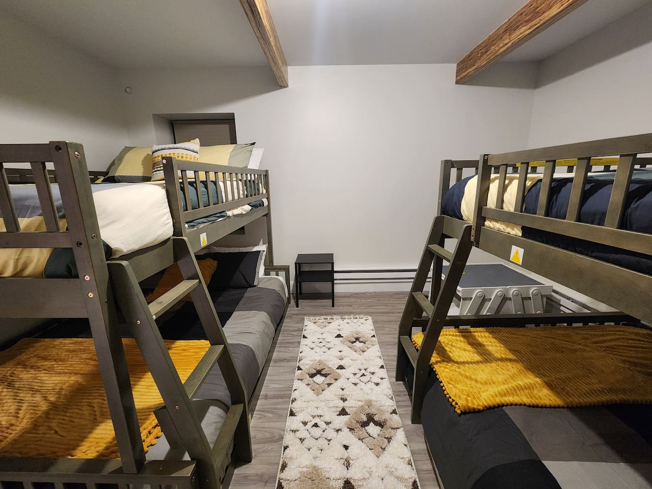 This bedroom has 2 bunk Beds Queen over full.