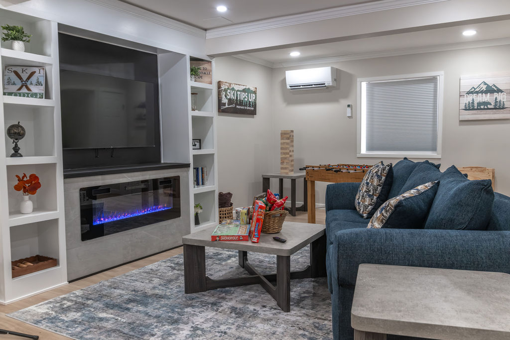 Enjoy the use of our first floor with amenities such as a Foosball Table, Karaoke Machine, Board Games, a Smart TV, work station, washer & dryer, electronic fireplace and blankets!