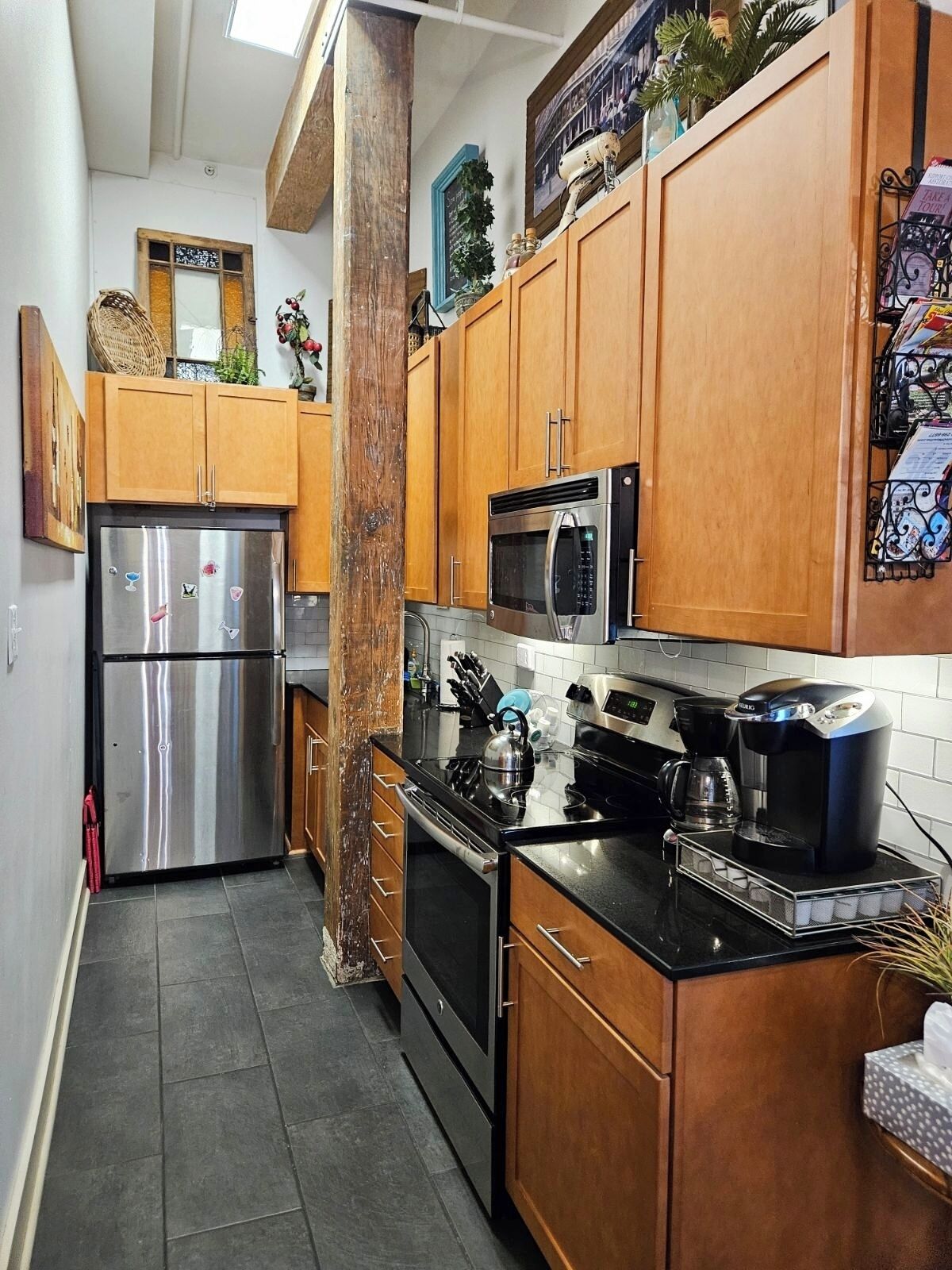 Galley kitchen, fully stocked.
