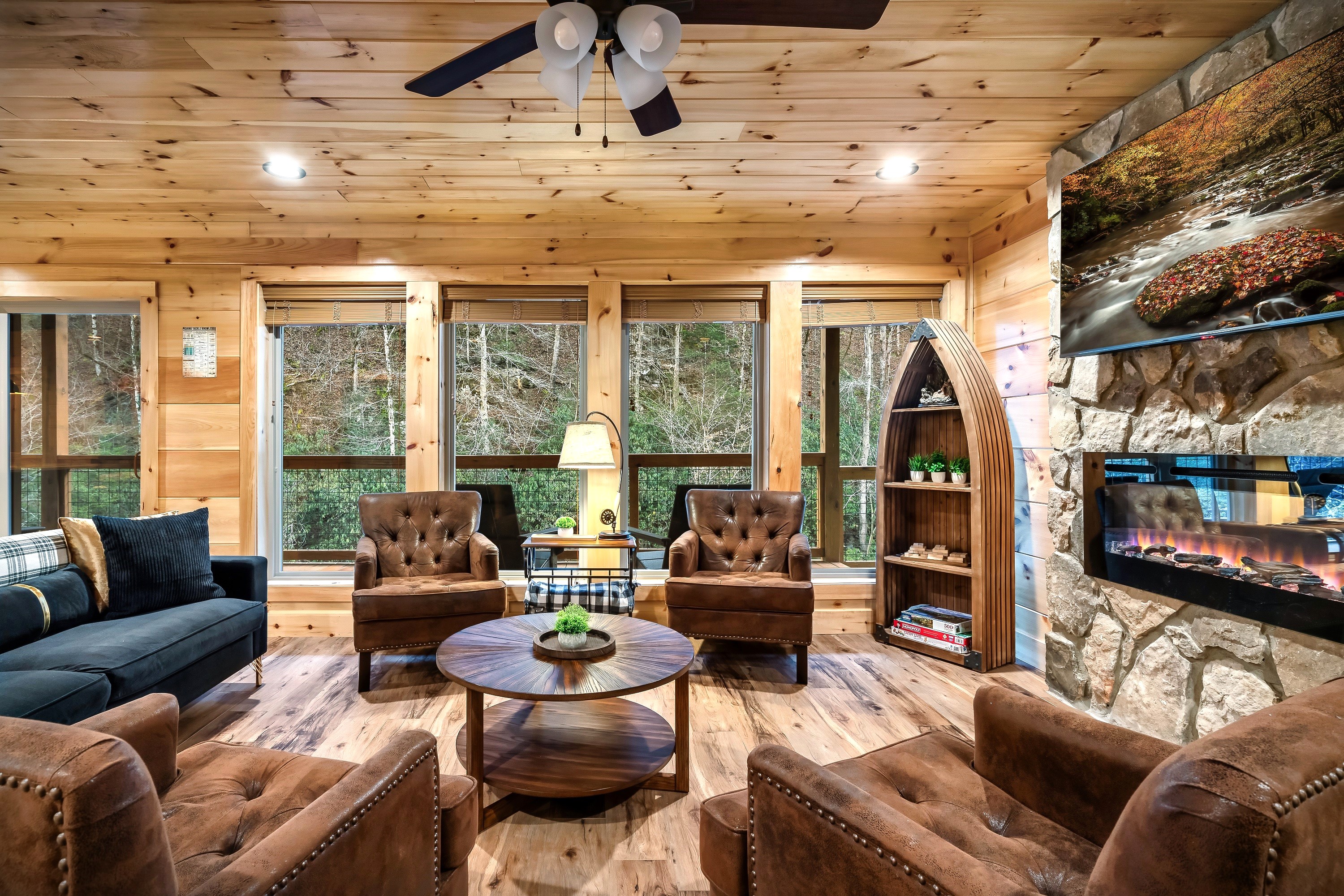 Another view of the living room with an electric fireplace to set the mood while still allowing plenty of lights come in from the multiple big windows.