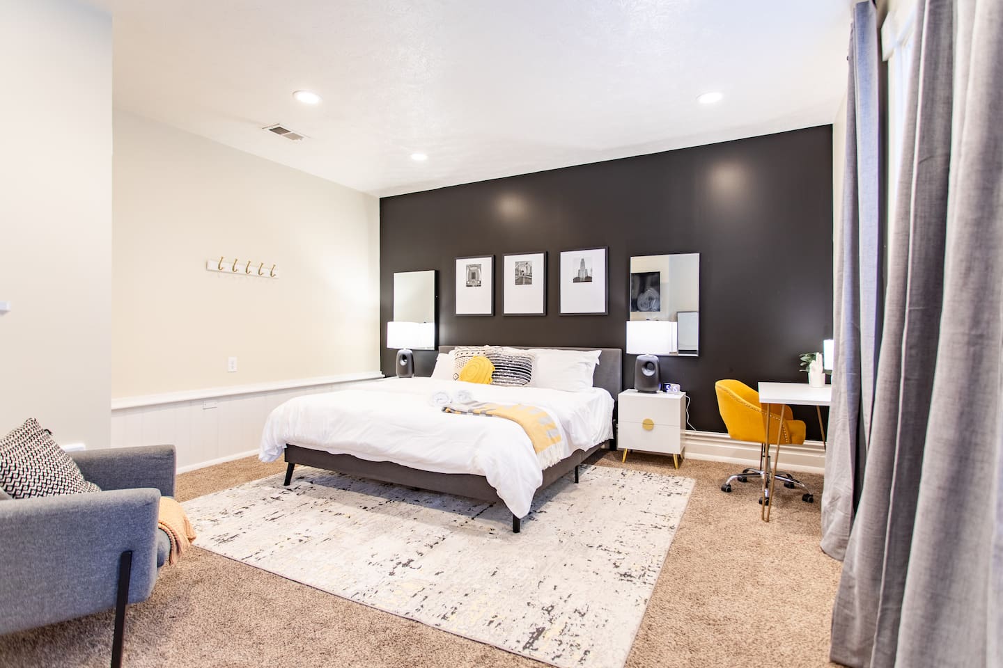 Spacious bedroom featuring a king bed, providing ample room for relaxation and comfort, perfect for a restful night's sleep.