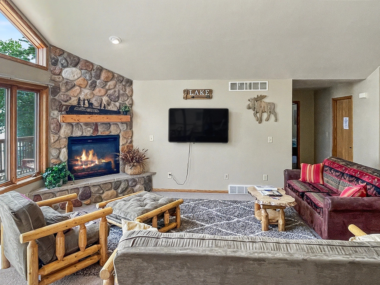Living Room - Lower Level with TV and Fireplace