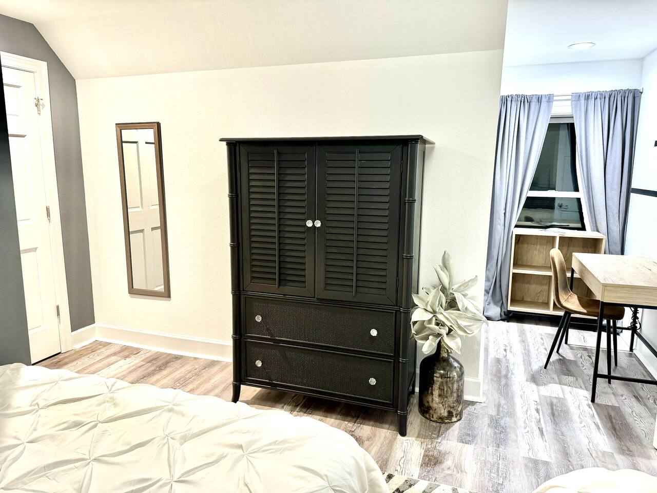 Dresser, work space chair in bedroom