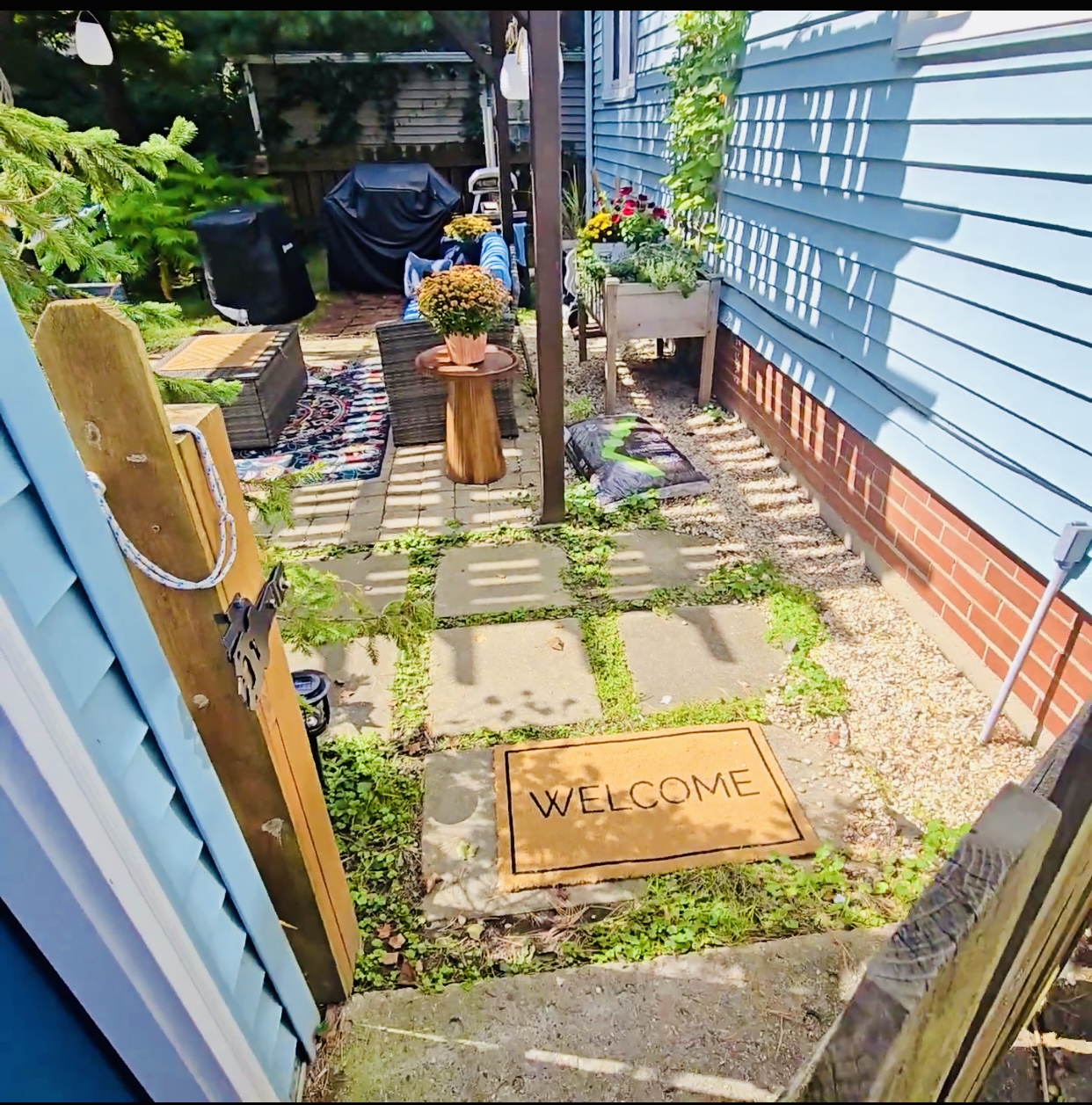 Step through the open gate and into backyard bliss—where the pergola invites lingering, herbs grow within reach, and the grill’s ready for your next gathering. Welcome mat’s out, and so are good vibes.