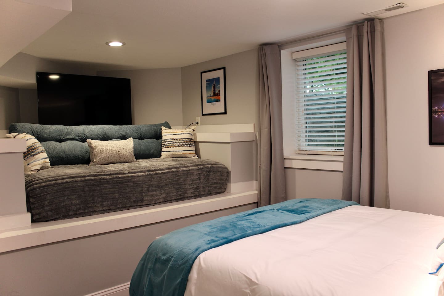 The Dubai Room on the Garden Level sleeps up to 3 in the Queen Bed and twin daybed and offers a Roku smart TV.