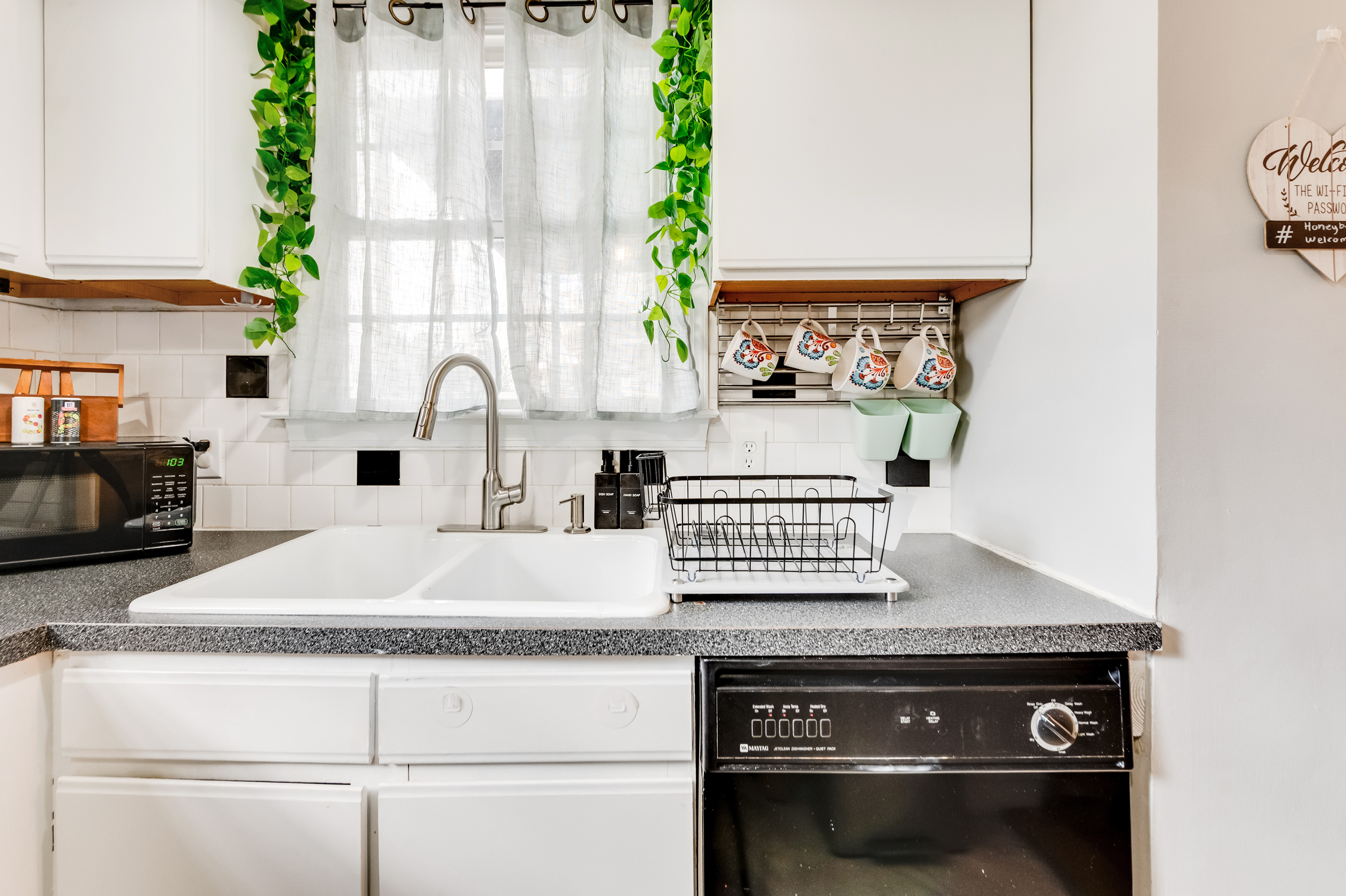 Kitchen: Whip up culinary delights in this bright, stylish space with charming decor!