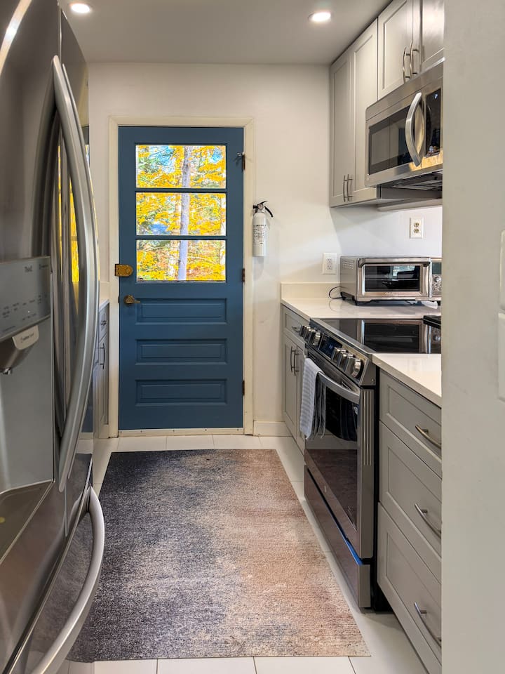 Galley kitchen on the second floor, next to the living and dining areas. 