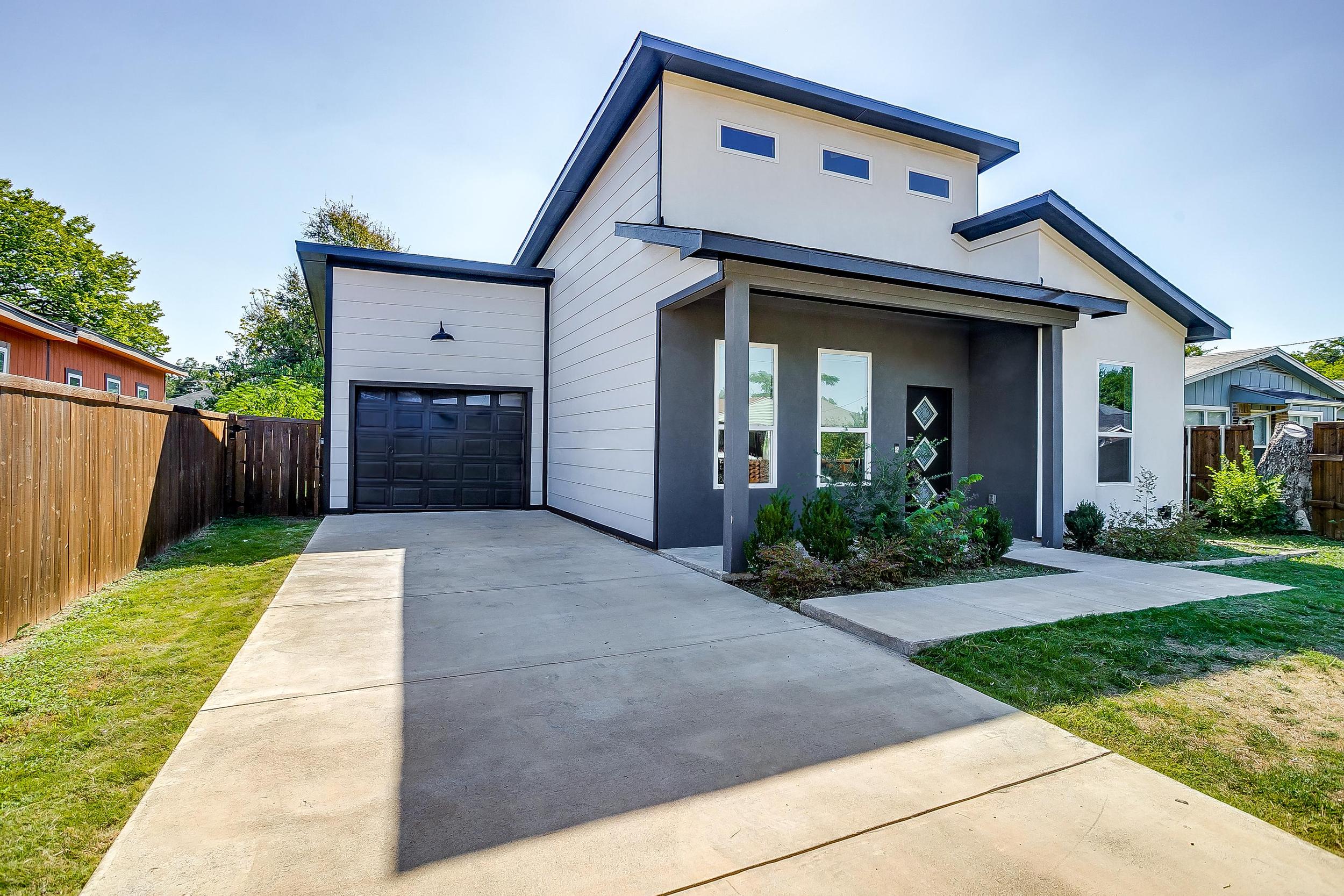 Modern curb appeal with private driveway – perfect for families or small groups.