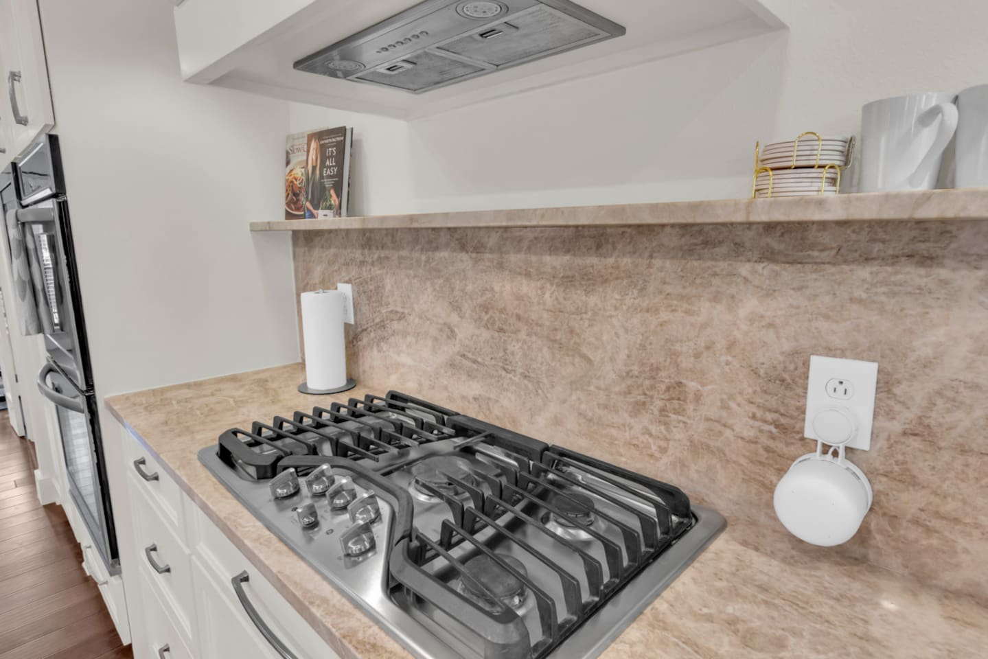 Additional view of the five-burner stainless steel gas stove, offering ample space and power for everyday cooking or hosting meals.
