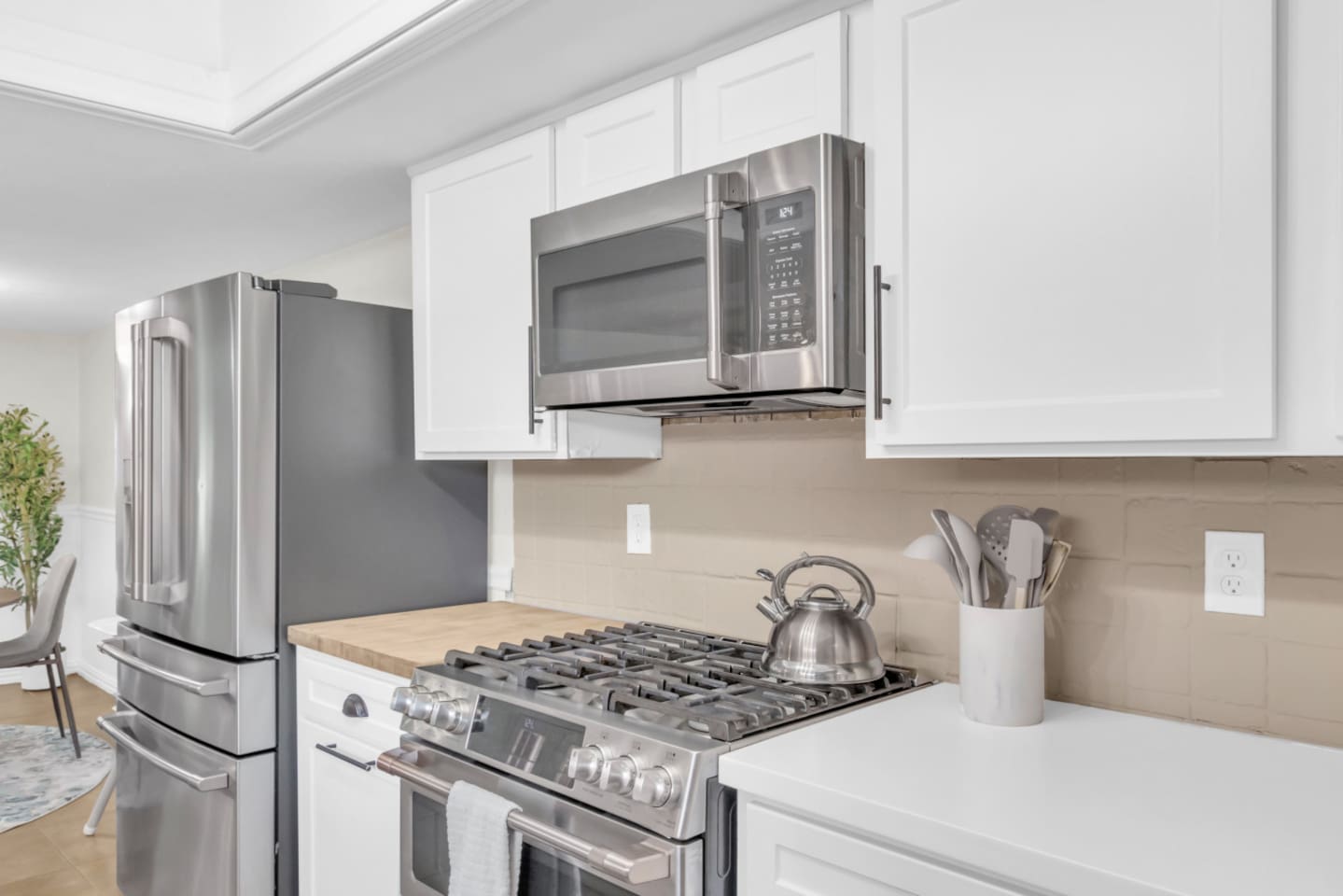 Sleek and functional updated kitchen with stainless steel appliances and style to spare.