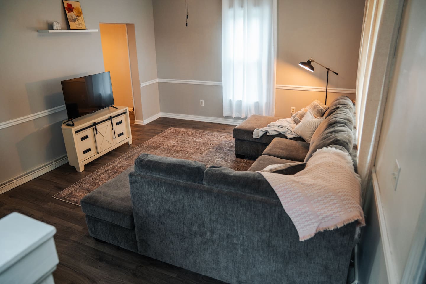Living room with couch and tv to get comfy and cozy 