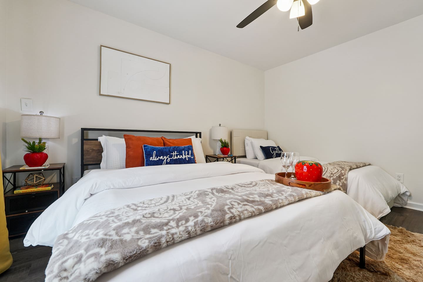 Another cozy bedroom featuring both a full bed and a twin bed, along with an Amazon Fire-powered Smart TV for your entertainment. This room includes 4 full-body towels, 4 washcloths, and 2 hand towels for your stay.