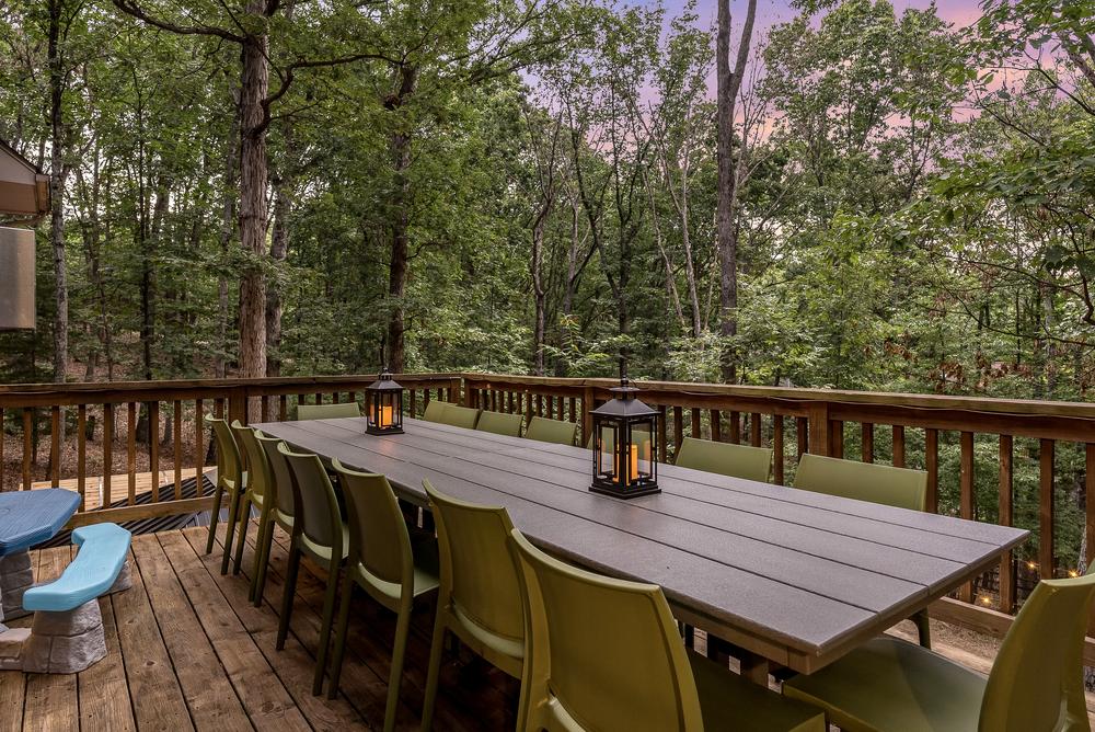 Deck dining at sunset overlooking forest