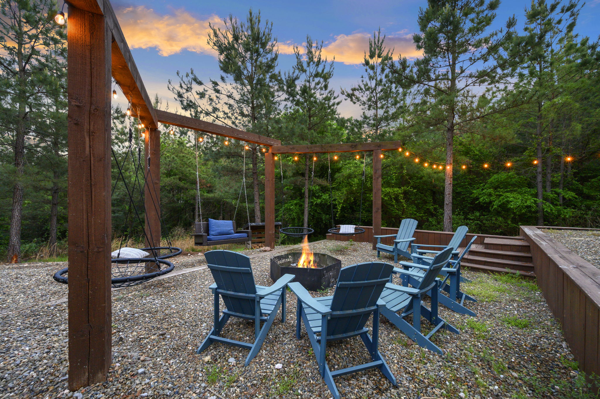 Gather around the fire pit with seating for the whole group—your go-to spot for relaxing nights at this Broken Bow cabin.