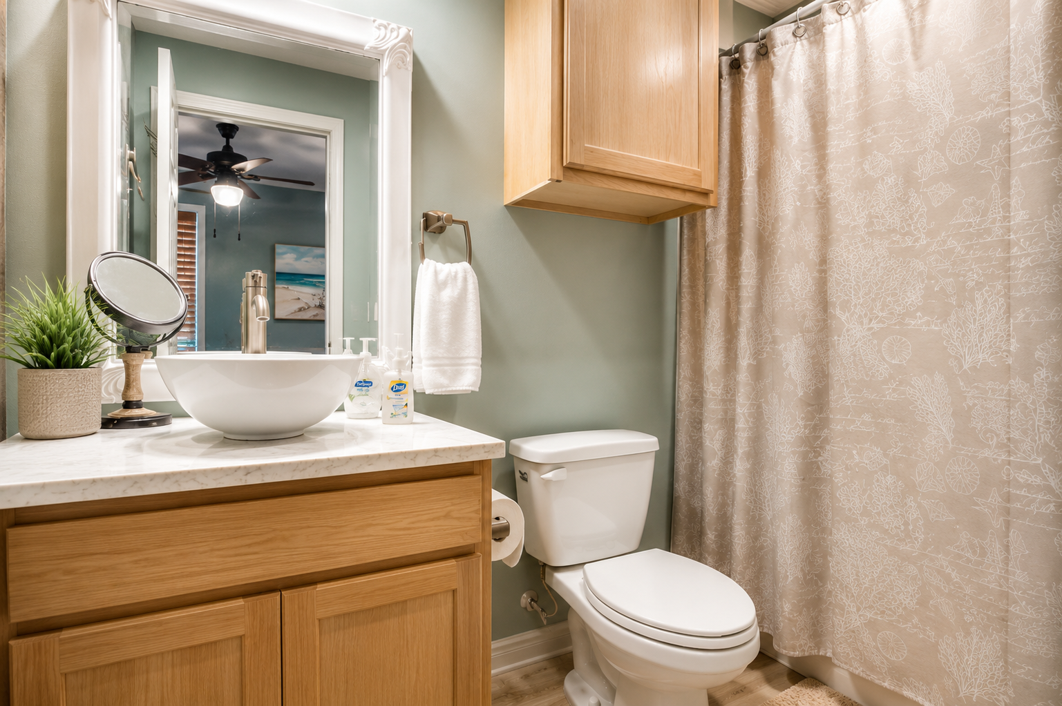 Fresh, bright bathroom with coastal touches and everything you need to get ready for another beautiful day on Okaloosa Island.