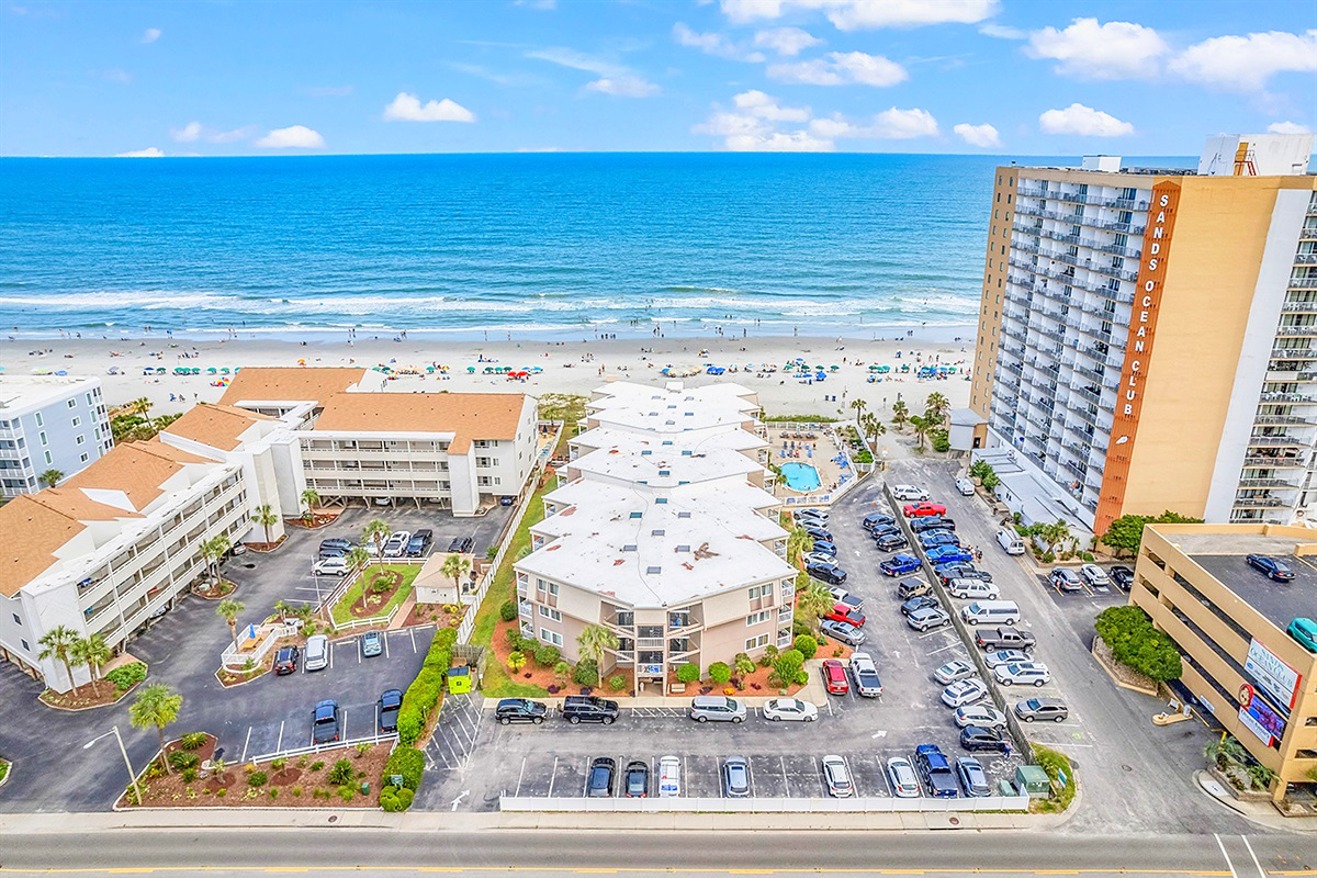 Aerial View – The complex, pool and wide sandy beach