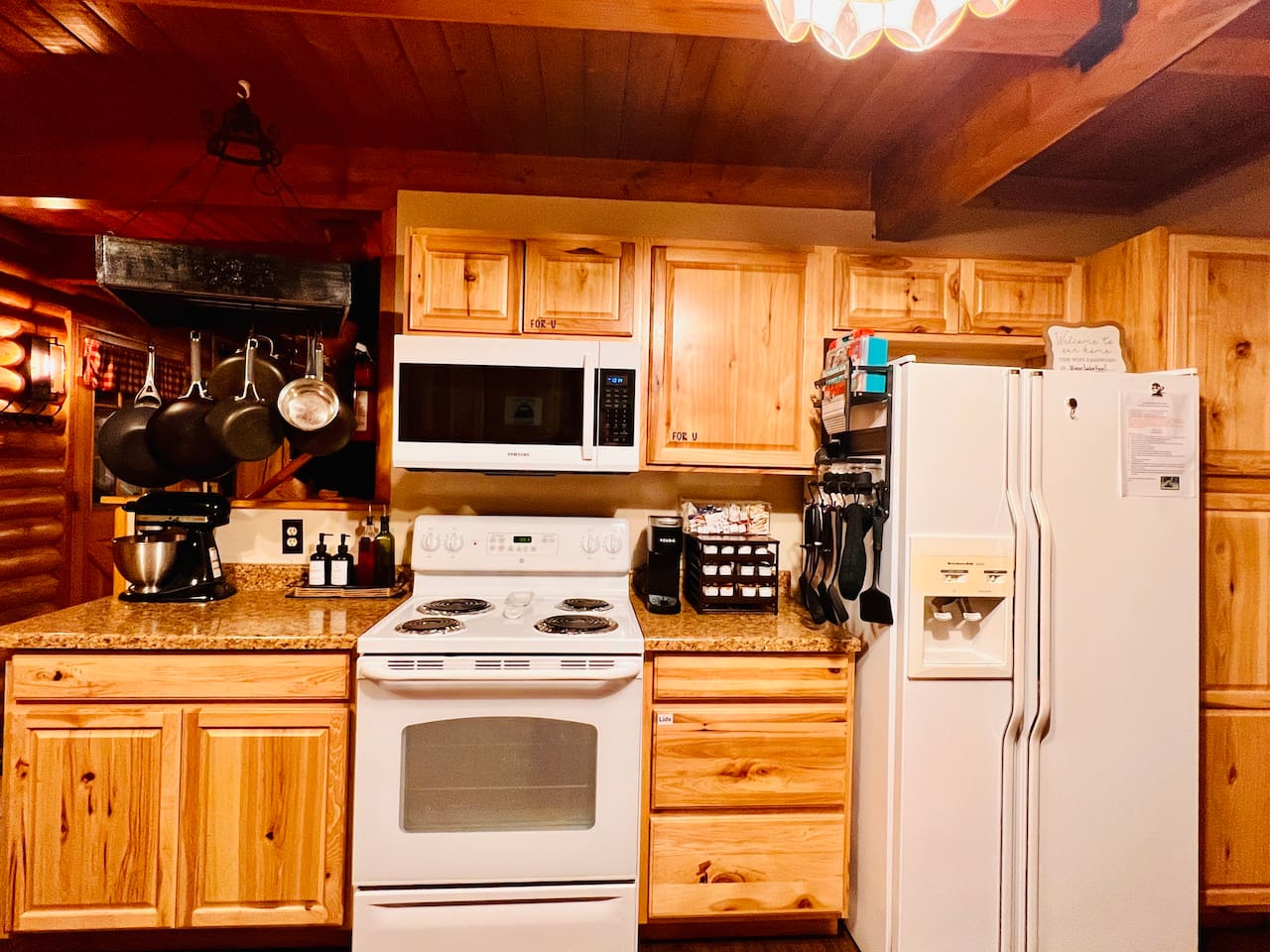 Main kitchen has 3 refrigerators, an eating area and is fully stocked with pots, pans, dishes and silverware.  It includes large and small cooking appliances and serving dishes of all sizes.