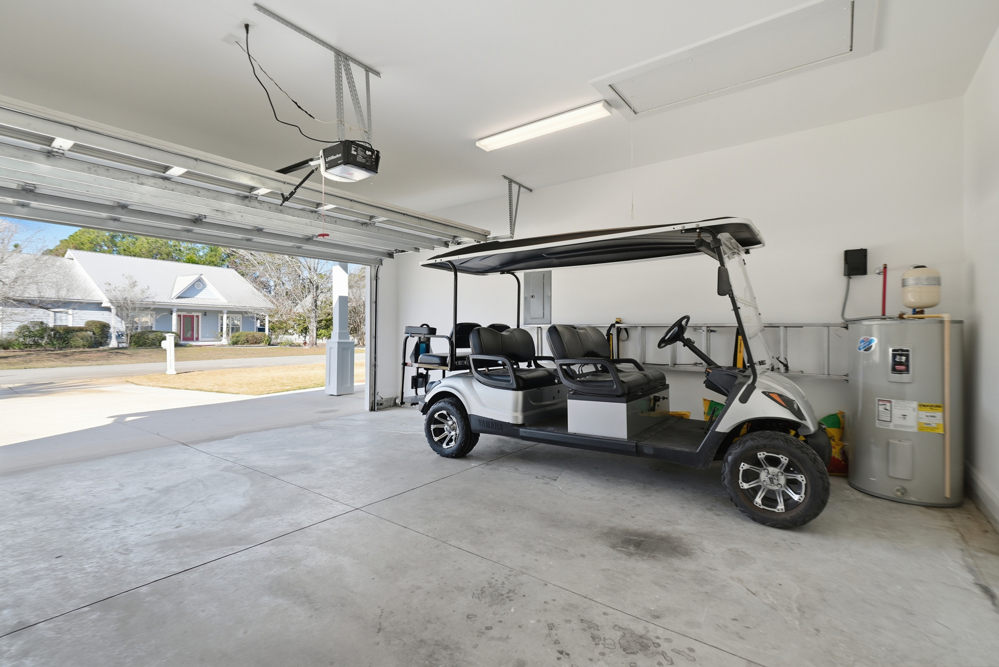 Complimentary golf cart stored in the garage for easy trips to the nearby beach and county piers.