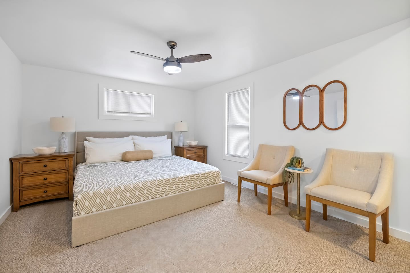 Master bedroom with a king sized bed. 