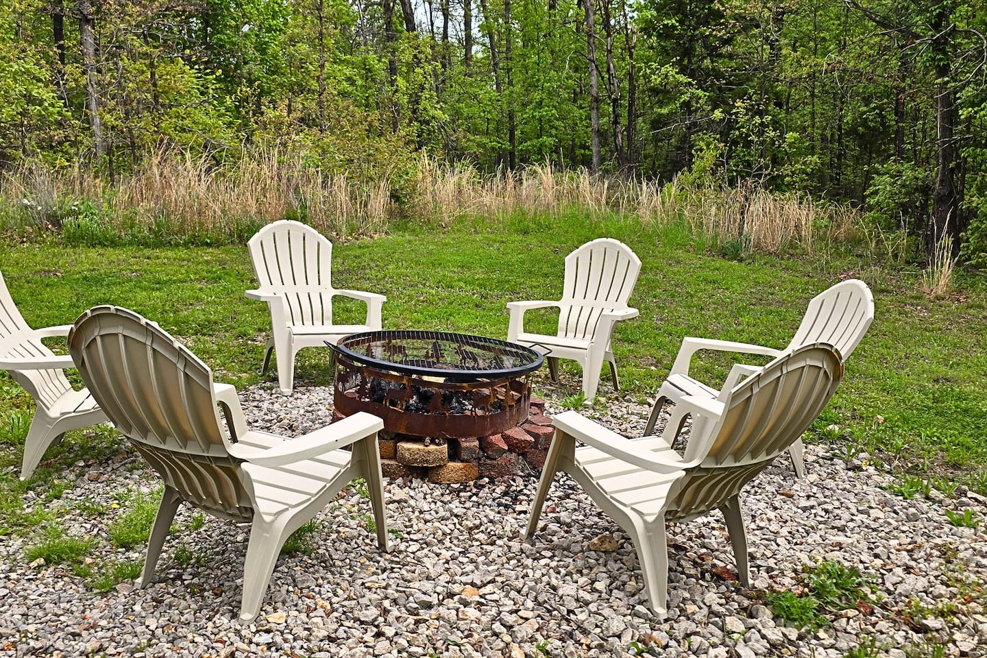 Gather around the fire pit under the stars and share stories, roast marshmallows, or just soak up the stillness of the woods. With comfy chairs and a grill top, it's the perfect spot for late-night laughs or rustic outdoor meals.