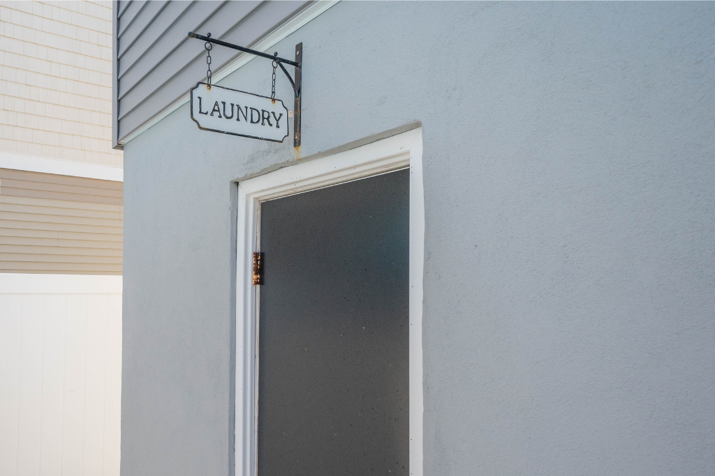 On-site laundry room with easy access, offering a practical setup for washing and drying during your stay. A convenient feature for longer visits, beach days, or keeping essentials fresh and ready.