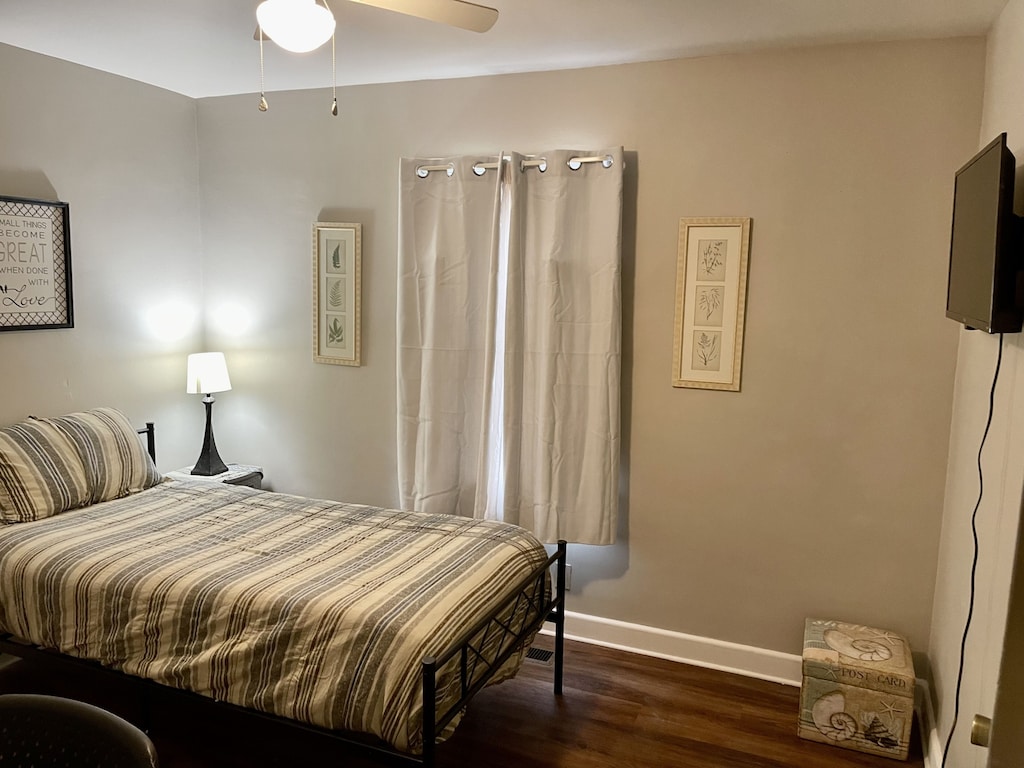 Williams Main — Twin XL bedroom with a writing desk, Smart TV, and games.