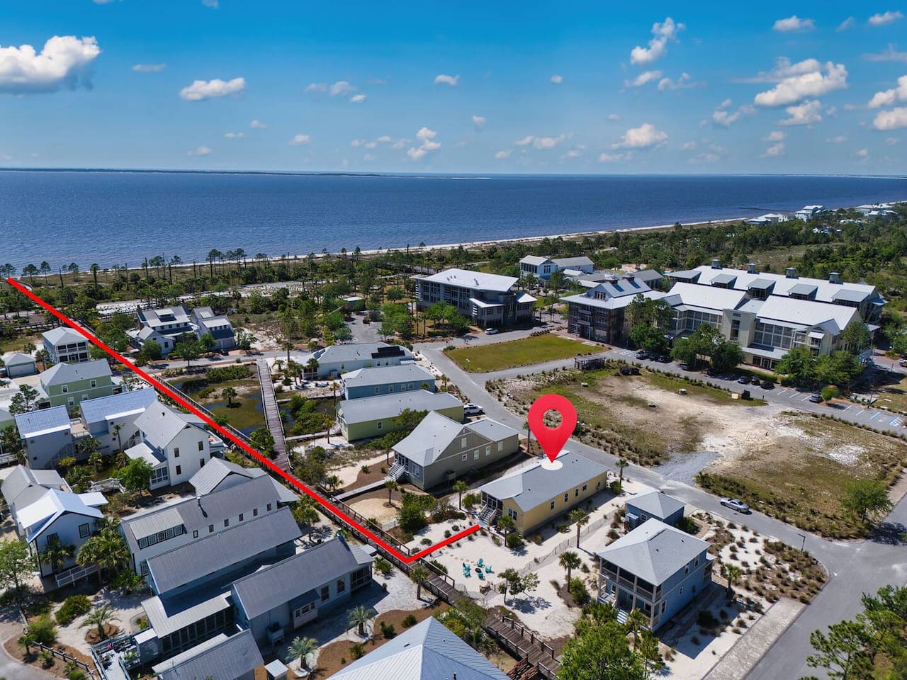 aerial view highlights the home's prime location and the easy walk to the beach