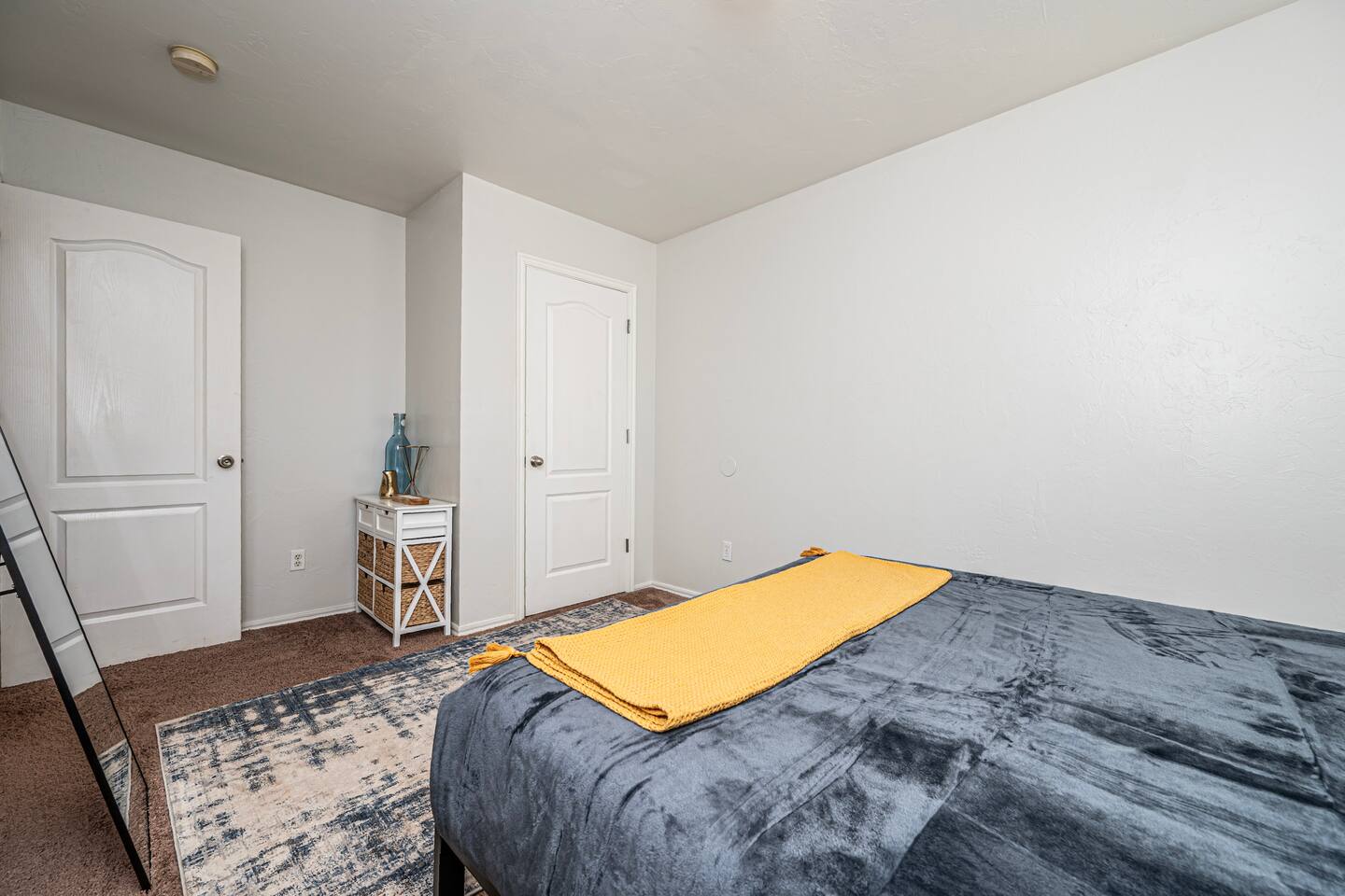 Relax in this stylish secondary bedroom with a comfortable queen bed.