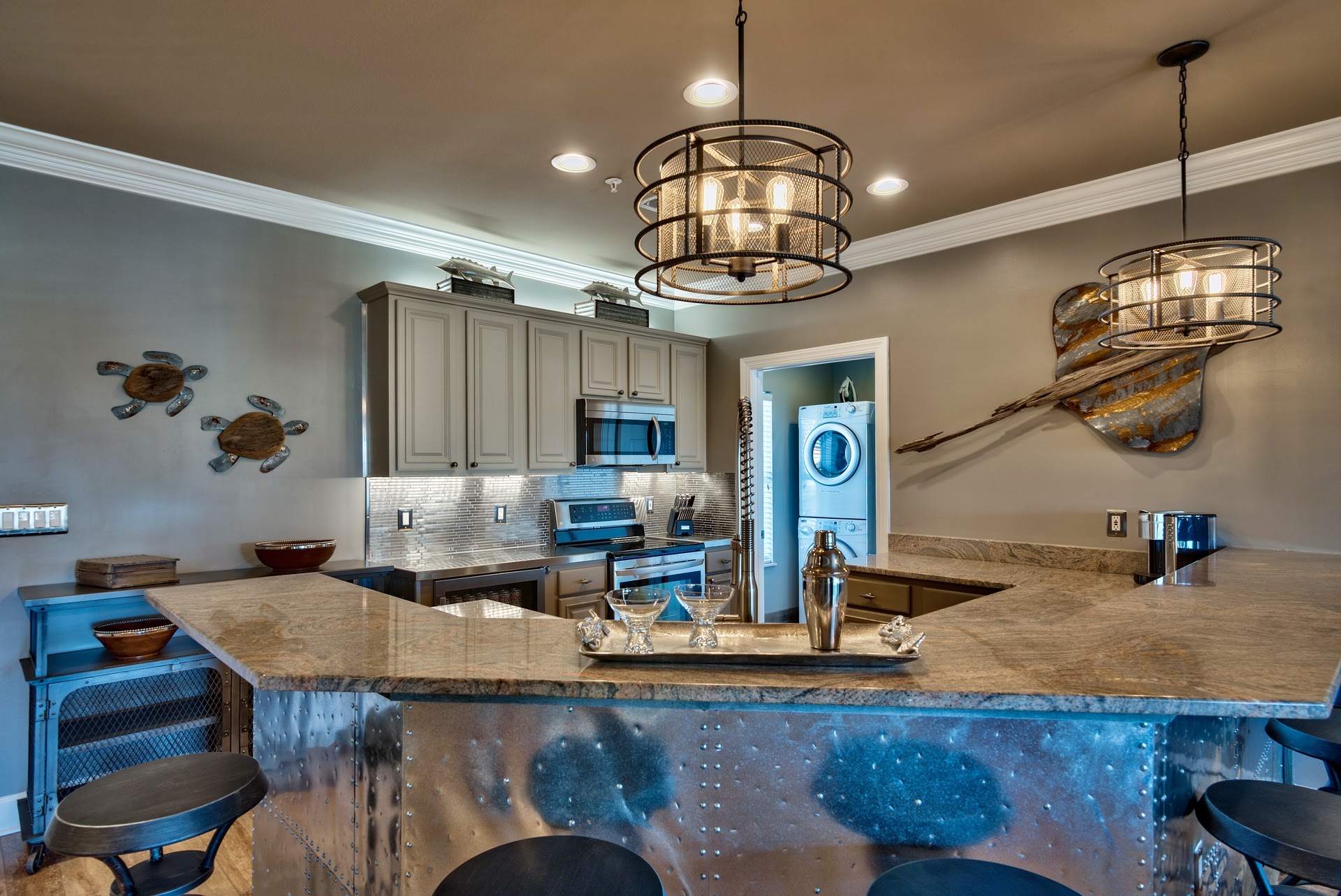 Kitchen with NOLA faucet, zero radius sink and stainless appliances.