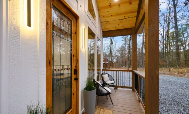Covered front porch with peaceful woodland views