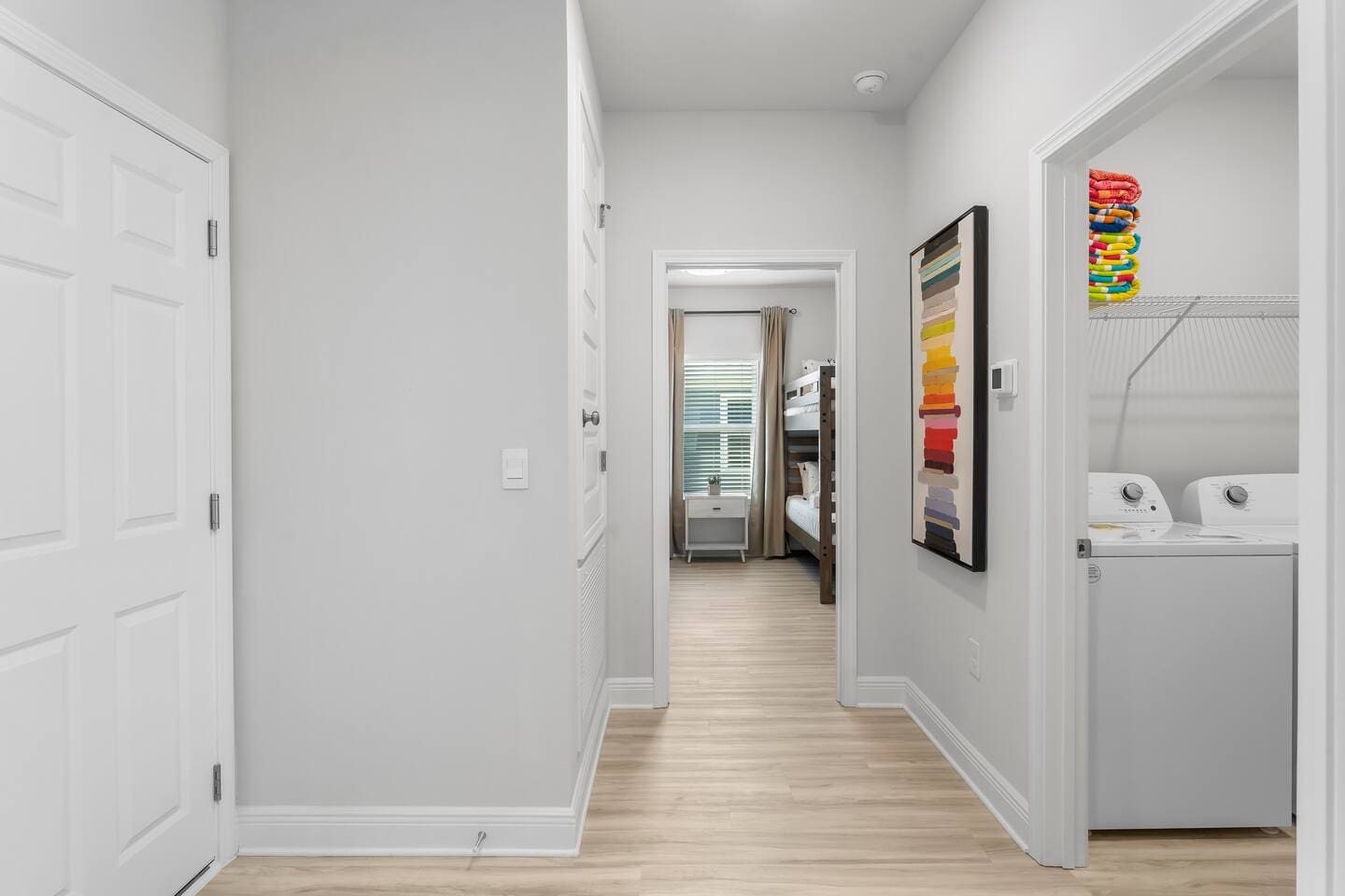 hallway going to bedroom and laundry room