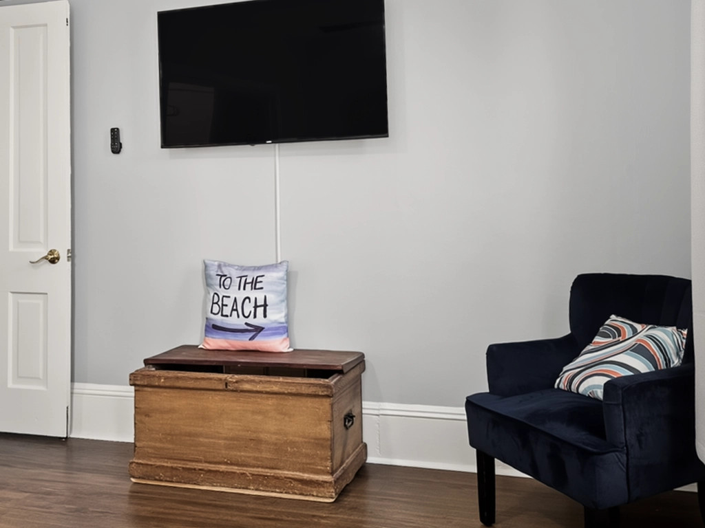 TV and sitting chair in the large King bedroom