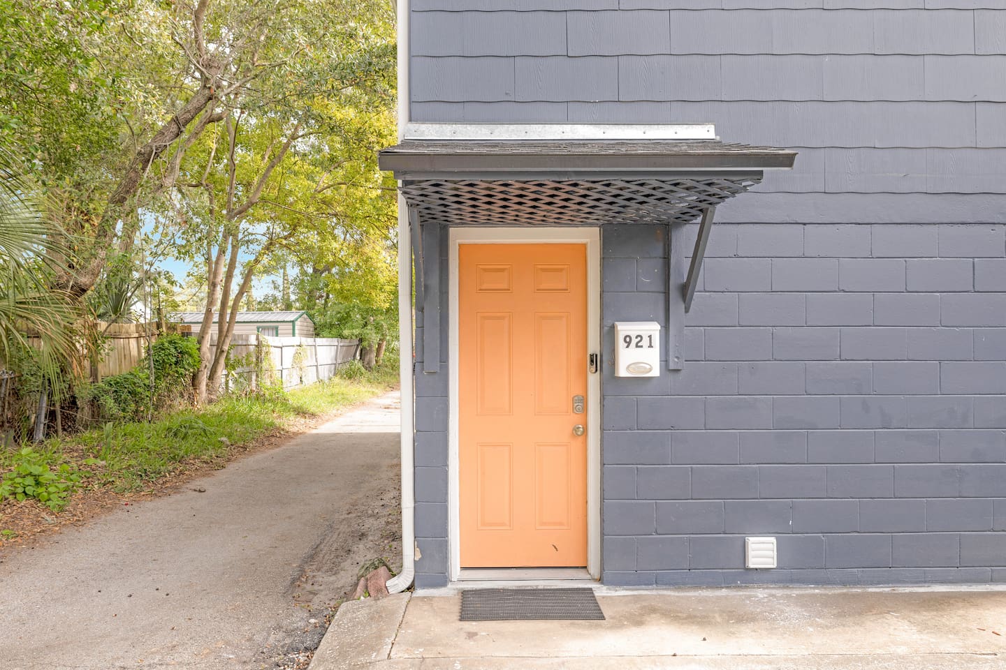 Home entrance in rear alleyway (outside of courtyard area)