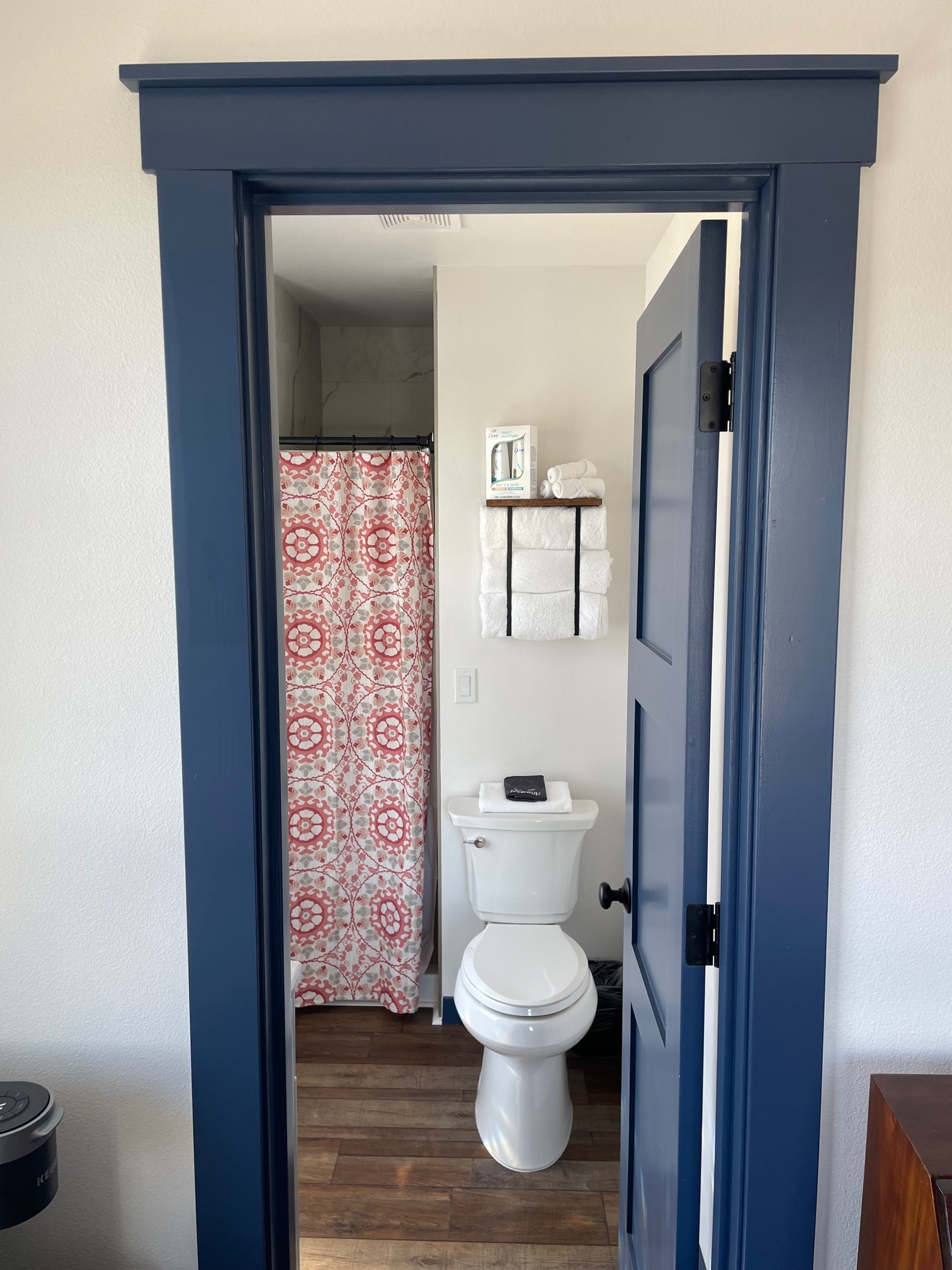 Personal bathroom with sink, toilet and shower.