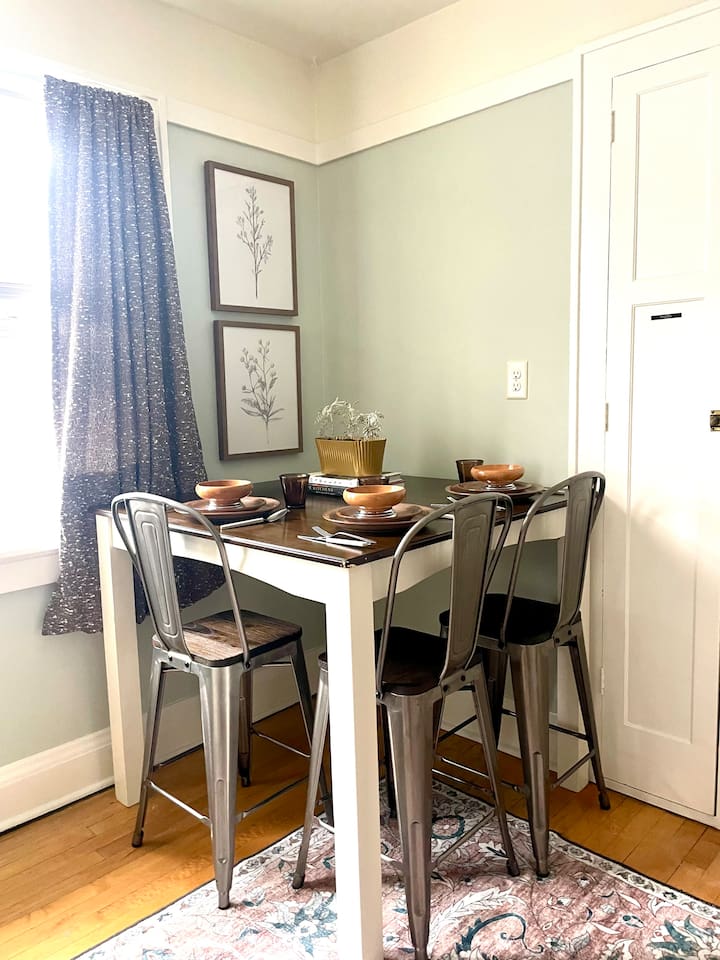 Kitchen dining nook with seating for four, perfect for meals, coffee, or planning the day.
