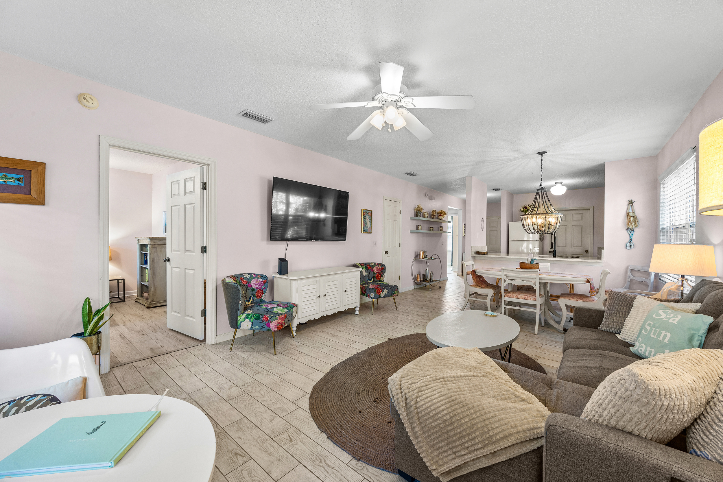 Bright and inviting living area with large ROKU TV for movie nights or family gatherings.