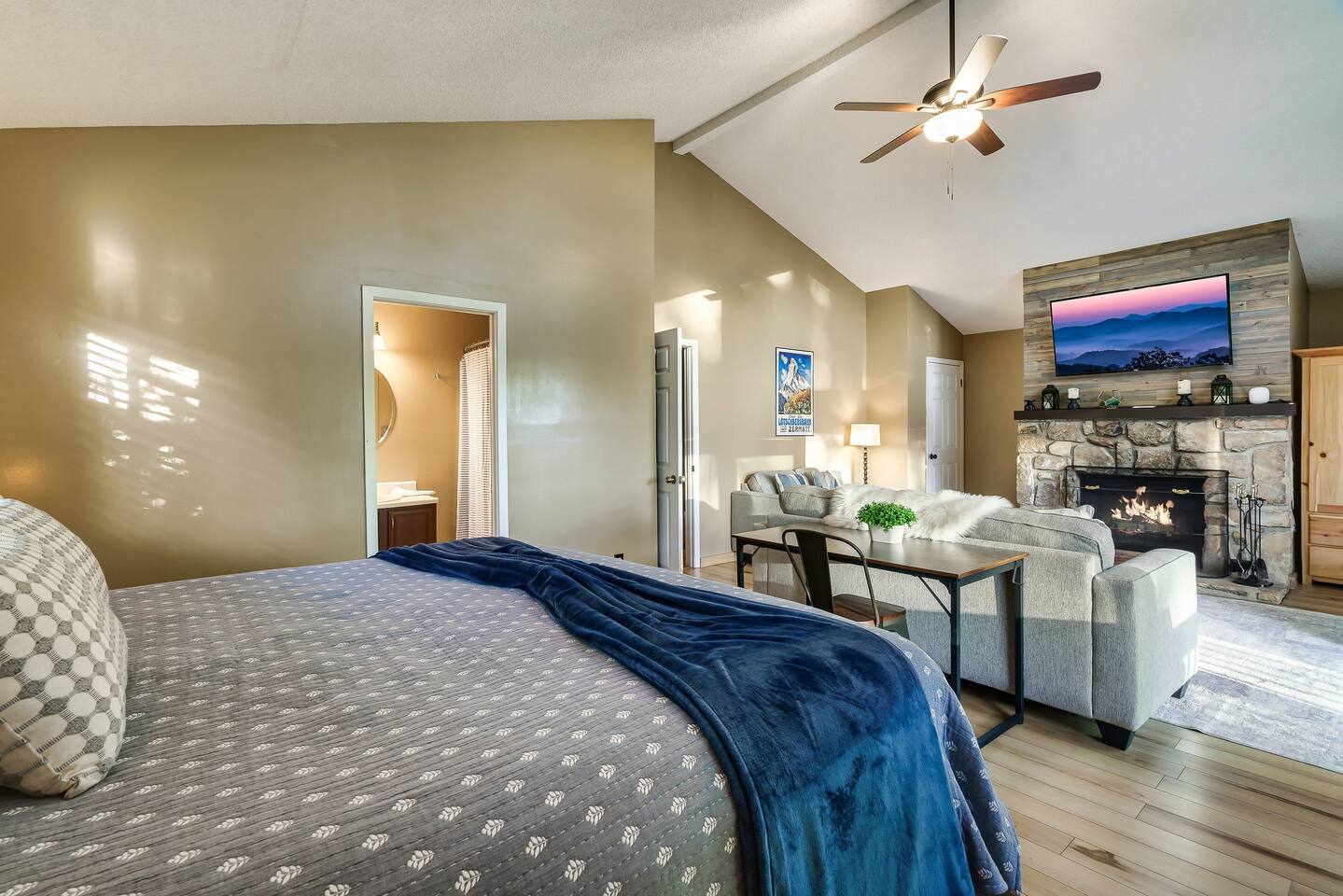 Private master bedroom suite on the top floor of the chalet. It includes a desk as a dedicated work space. Take in the mountain scenery while you work (if you must)!